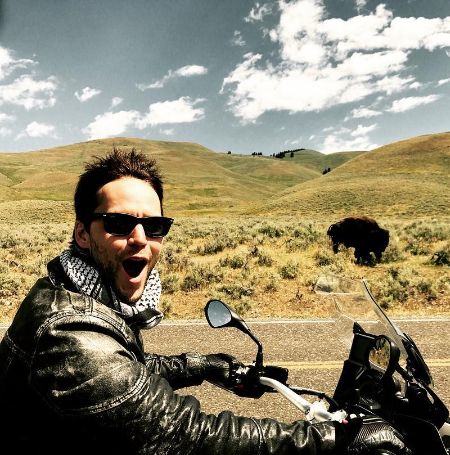 Taylor Kitsch took a picture as he rode on his motorbike.